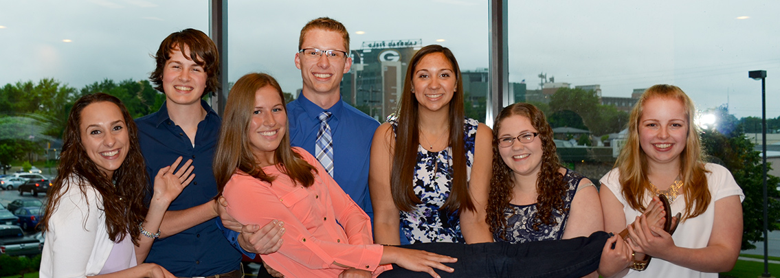 Past recipients of the Tom Young Educational Scholarship gathered together