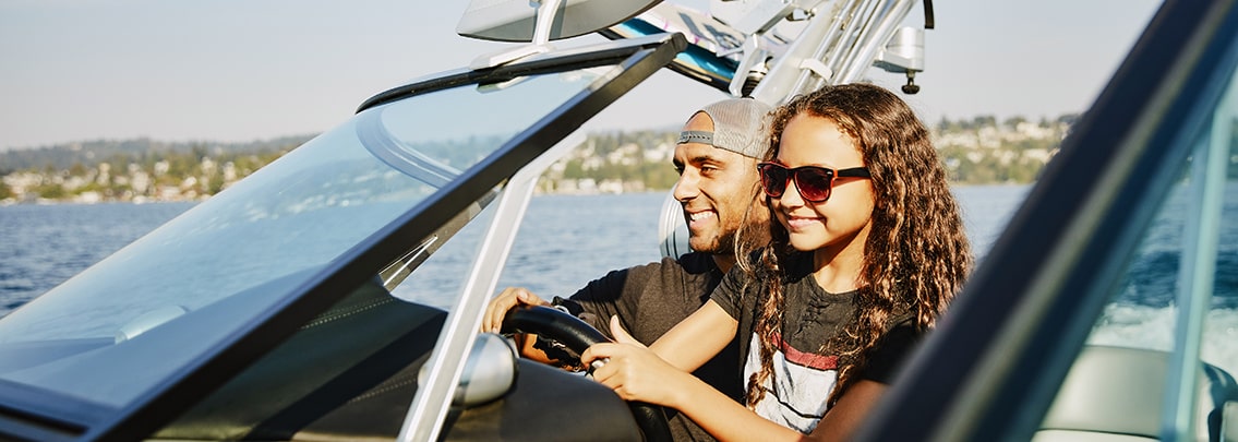 girl driving a boat.