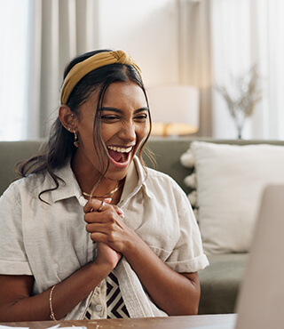 lady excited looking at the screen.