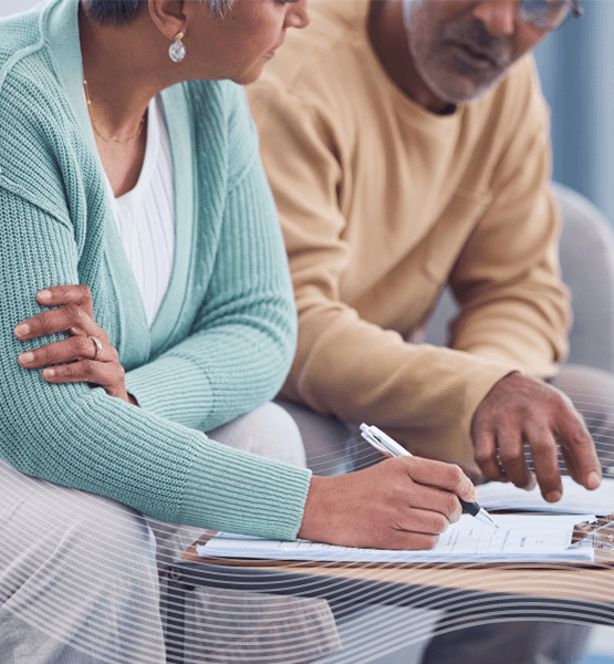 Couple working on a document together.