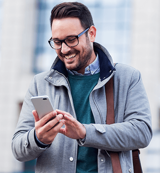 middle aged man looking at his phone .