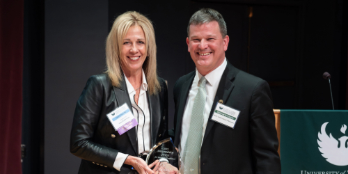Capital Credit Union CEO Laurie Butz ’91 poses with UW-Green Bay Cofrin School of Business Dean Matt Dornbush at the 2025 Business Keynote event.