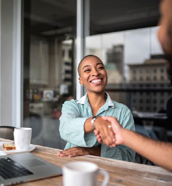 business woman shaking hands at a deal