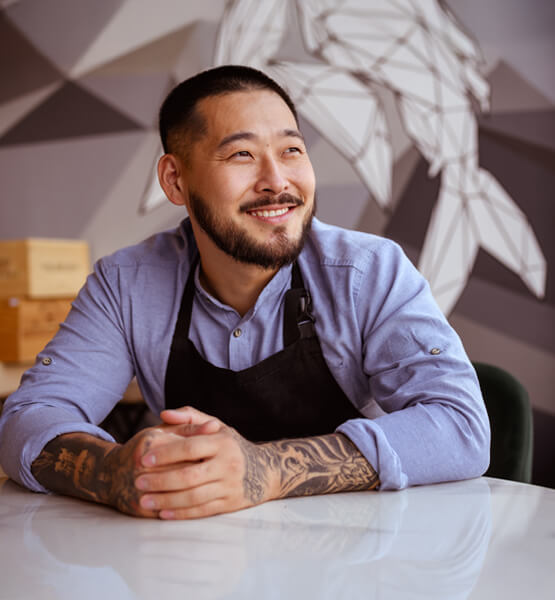 Business owner smiling.