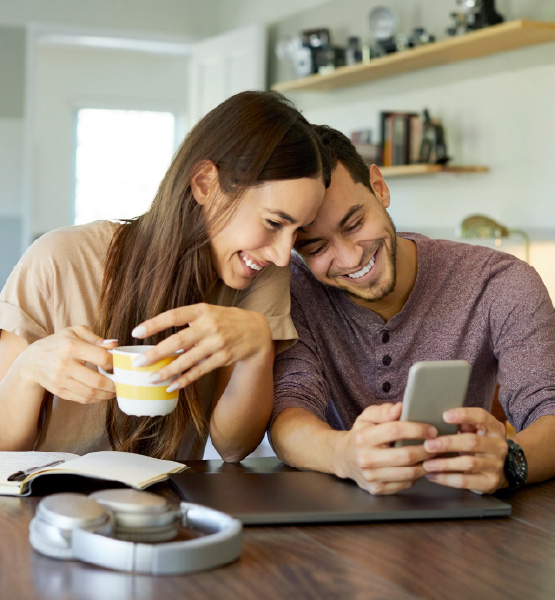Couple using Capital Credit Union digital
banking mobile app