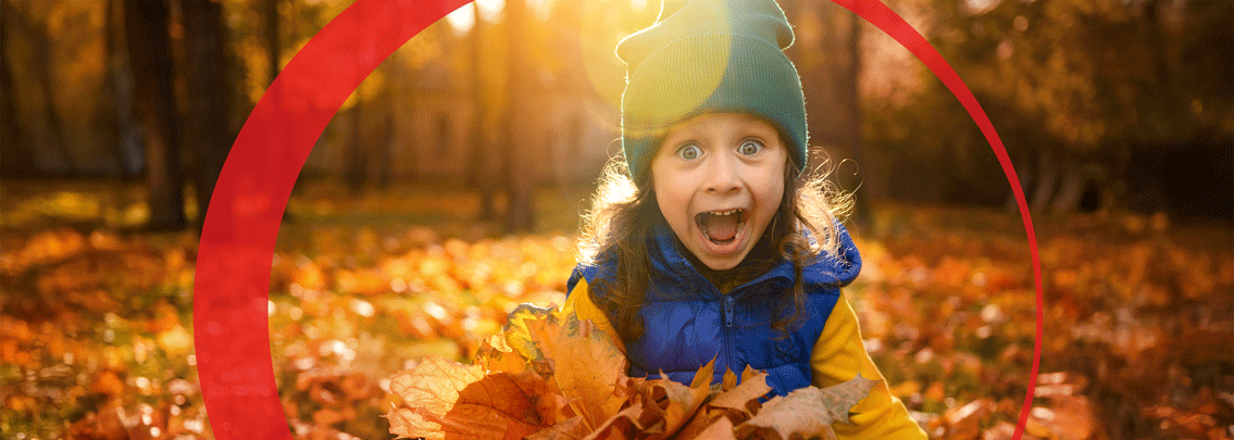 Girl playing with leaves. 
