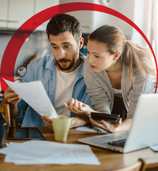 Couple doing calculations and working on a document  together