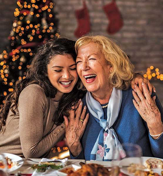 two women laughing in a holiday location