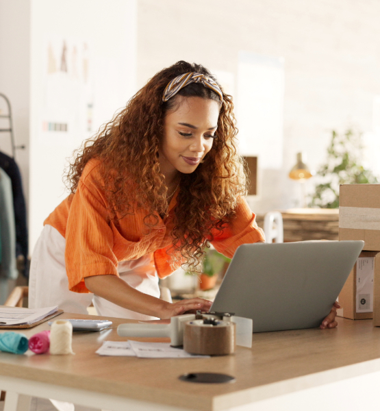 Lady looking at her laptop.