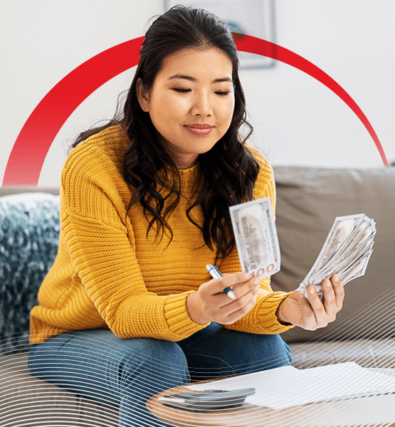A woman budgeting and counting cash.