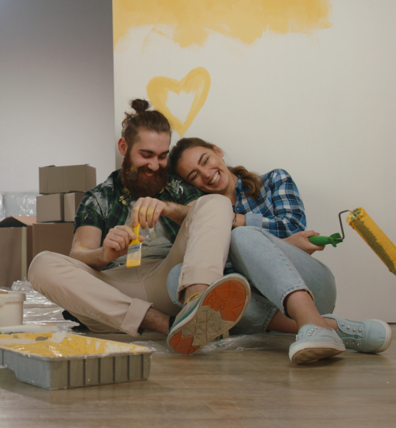 Couple painting home renovating.